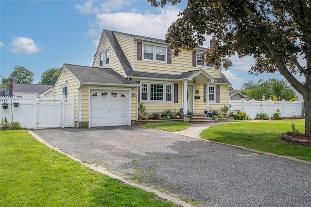 1547 Lincoln Blvd, Bay Shore, NY 11706 - traditional home featuring an attached garage, asphalt driveway, a gate, and roof with shingles