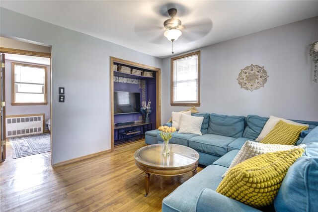 1547 Lincoln Blvd, Bay Shore, NY 11706 - living room with radiator heating unit, healthy amount of natural light, light wood finished floors, and ceiling fan