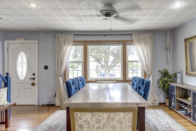 1547 Lincoln Blvd, Bay Shore, NY 11706 - dining space featuring an ornate ceiling, light wood-style flooring, a baseboard heating unit, ceiling fan, and recessed lighting