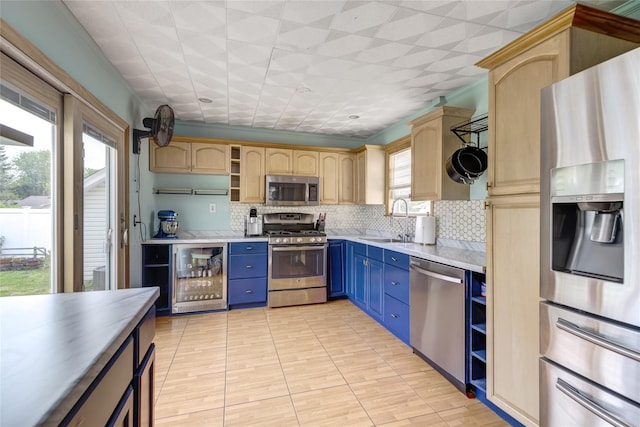 1547 Lincoln Blvd, Bay Shore, NY 11706 - kitchen featuring appliances with stainless steel finishes, blue cabinetry, beverage cooler, a sink, and open shelves