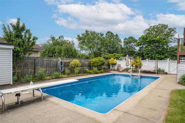 1547 Lincoln Blvd, Bay Shore, NY 11706 - view of swimming pool with a fenced backyard, a diving board, and a patio