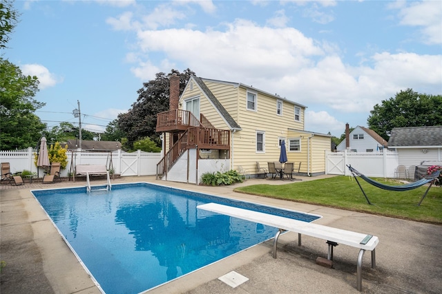 1547 Lincoln Blvd, Bay Shore, NY 11706 - view of swimming pool with a gate, a patio, a diving board, stairway, and a wooden deck
