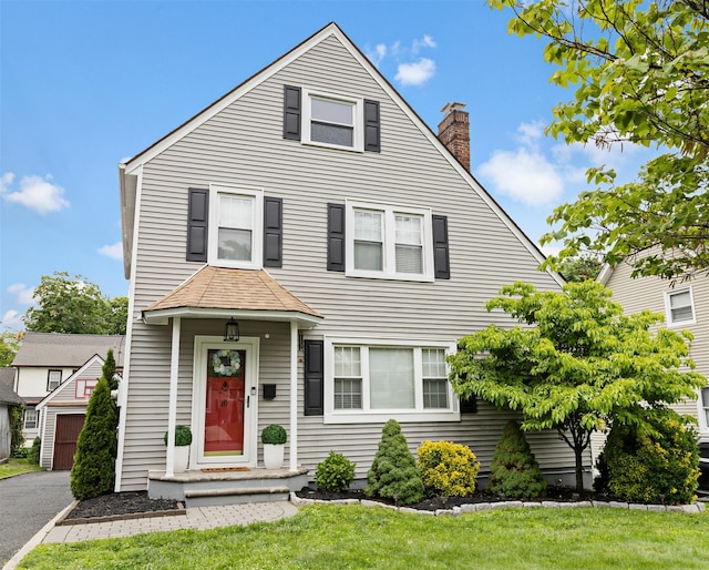 10 Mcbride Ave, White Plains, NY 10603 - view of front of home featuring a chimney and a front yard