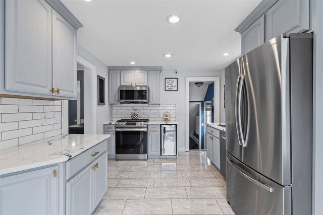10 Mcbride Ave, White Plains, NY 10603 - kitchen with appliances with stainless steel finishes, gray cabinetry, backsplash, recessed lighting, and wine cooler
