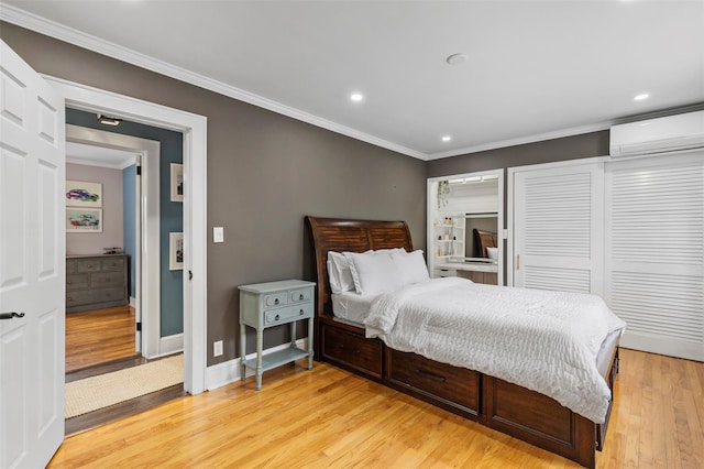 10 Mcbride Ave, White Plains, NY 10603 - bedroom featuring a wall mounted air conditioner, ornamental molding, light wood-style floors, baseboards, and recessed lighting