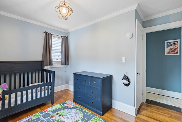 10 Mcbride Ave, White Plains, NY 10603 - bedroom with wood finished floors, baseboards, ornamental molding, and a nursery area