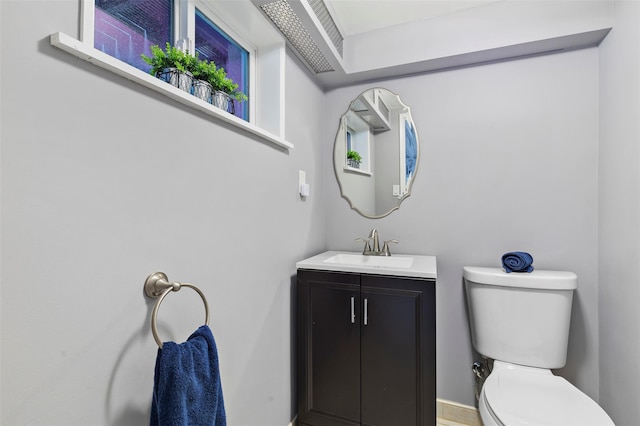 10 Mcbride Ave, White Plains, NY 10603 - half bathroom with vanity, toilet, and baseboards