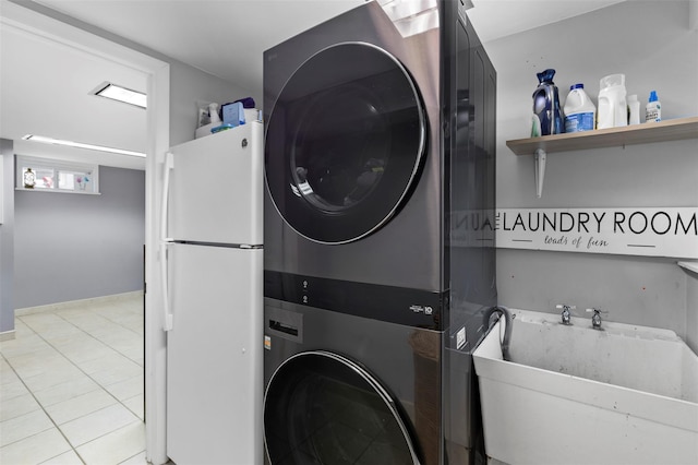 10 Mcbride Ave, White Plains, NY 10603 - laundry area featuring stacked washer / dryer and tile patterned floors