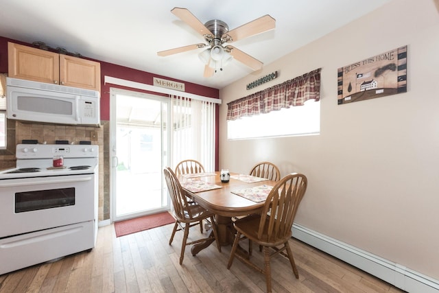 820 Mirabelle Ave, Westbury, NY 11590 - dining area featuring a baseboard radiator, light wood finished floors, and healthy amount of natural light