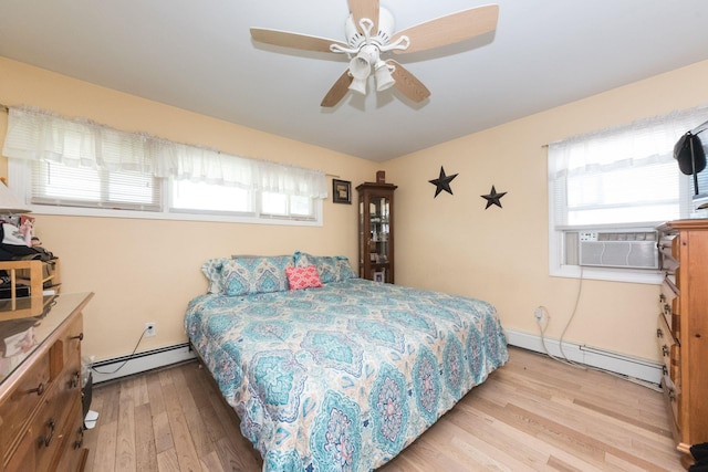 820 Mirabelle Ave, Westbury, NY 11590 - bedroom with baseboard heating, a baseboard heating unit, wood finished floors, cooling unit, and a ceiling fan