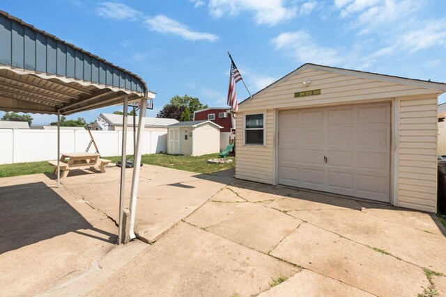 820 Mirabelle Ave, Westbury, NY 11590 - detached garage featuring driveway and a shed