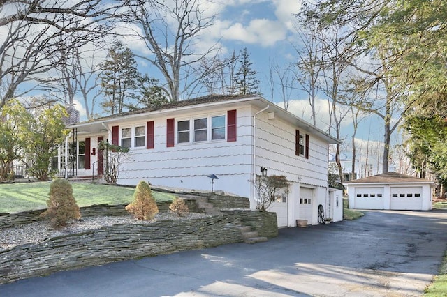 10 Glenbrook Rd, Monsey, NY 10952 - view of front of home with a chimney, a garage, an outdoor structure, and a front yard