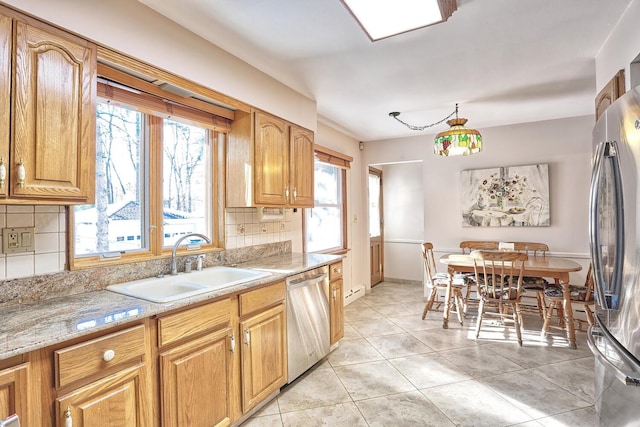 10 Glenbrook Rd, Monsey, NY 10952 - kitchen featuring stainless steel appliances, a sink, decorative backsplash, light tile patterned floors, and baseboards
