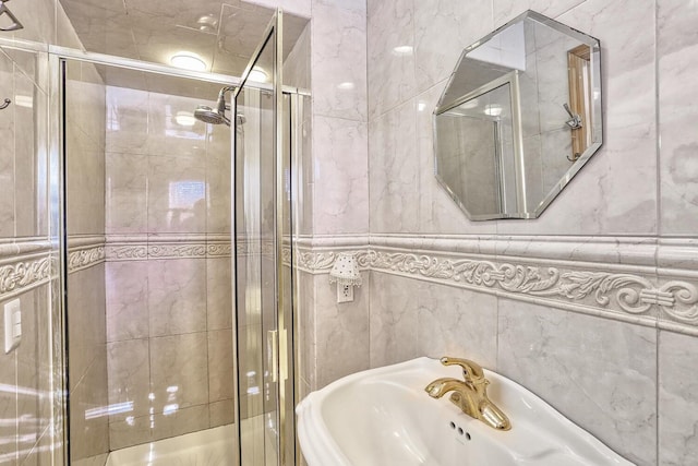 10 Glenbrook Rd, Monsey, NY 10952 - bathroom featuring tile walls, a shower stall, and a sink