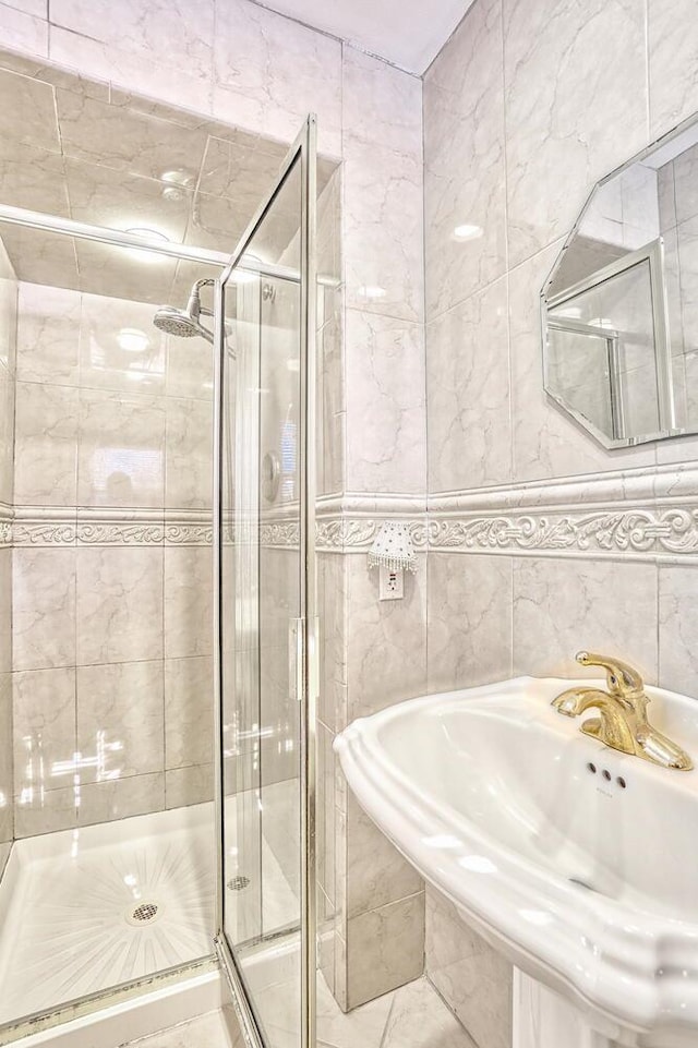 10 Glenbrook Rd, Monsey, NY 10952 - bathroom with a shower stall, tile walls, and a sink