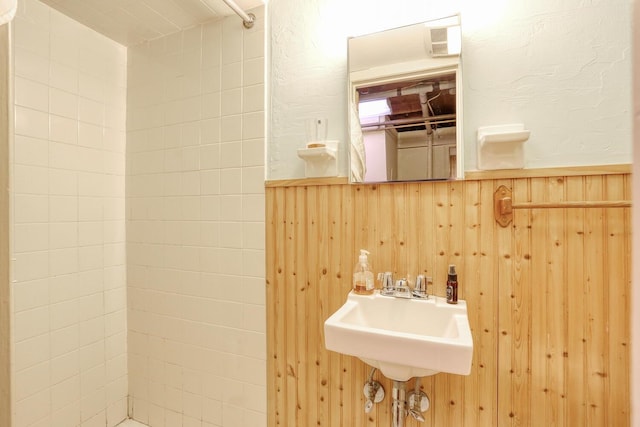 10 Glenbrook Rd, Monsey, NY 10952 - bathroom with a sink, tiled shower, and wooden walls