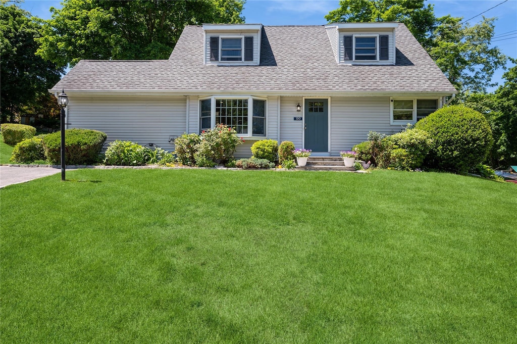 130 Rita Dr, Cortlandt Manor, NY 10567 - view of front of home featuring a shingled roof and a front yard