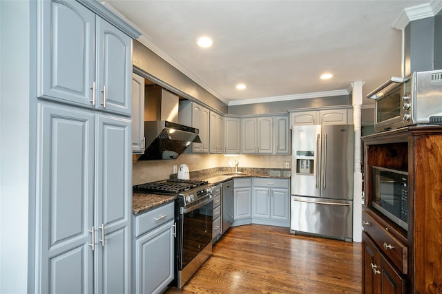 6 Willow Dr, Massapequa Park, NY 11762 - kitchen with appliances with stainless steel finishes, wall chimney exhaust hood, crown molding, a sink, and backsplash