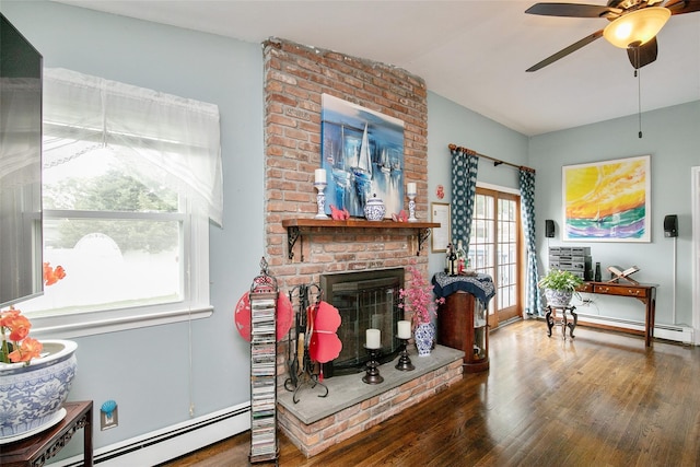 6 Willow Dr, Massapequa Park, NY 11762 - living area with a baseboard radiator, ceiling fan, wood finished floors, a brick fireplace, and lofted ceiling