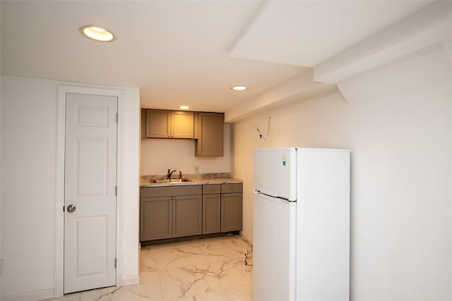 6 Willow Dr, Massapequa Park, NY 11762 - kitchen featuring freestanding refrigerator, a sink, light marble finish floors, recessed lighting, and gray cabinets