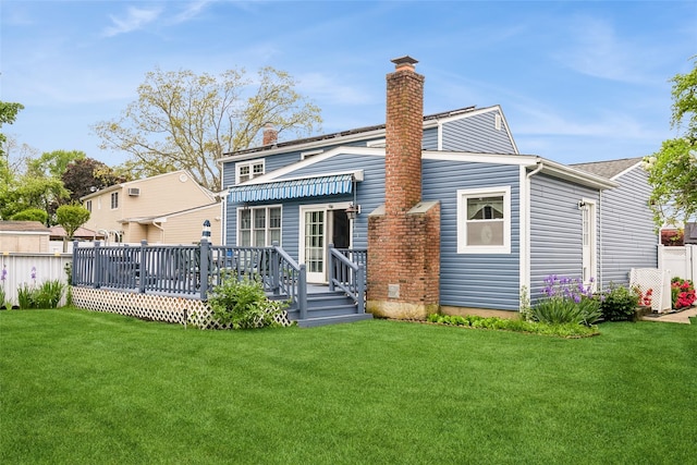 6 Willow Dr, Massapequa Park, NY 11762 - back of property featuring a lawn, a chimney, and a deck