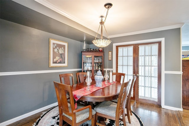 6 Willow Dr, Massapequa Park, NY 11762 - dining area with healthy amount of natural light, ornamental molding, baseboards, wood finished floors, and french doors