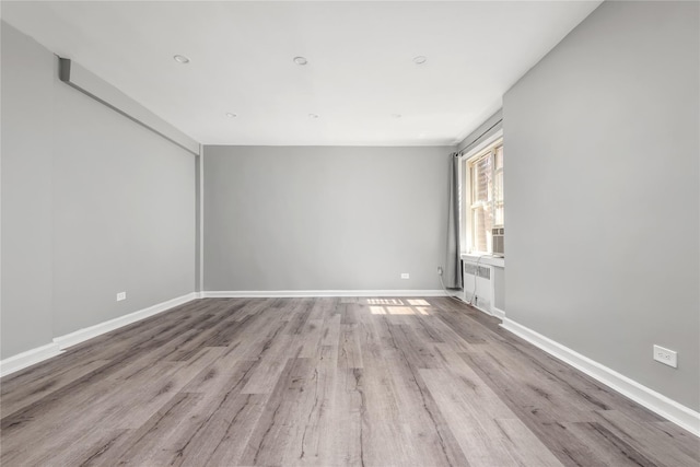 3965 51st St Unit 1C, Woodside, NY 11377 - spare room featuring wood finished floors and baseboards