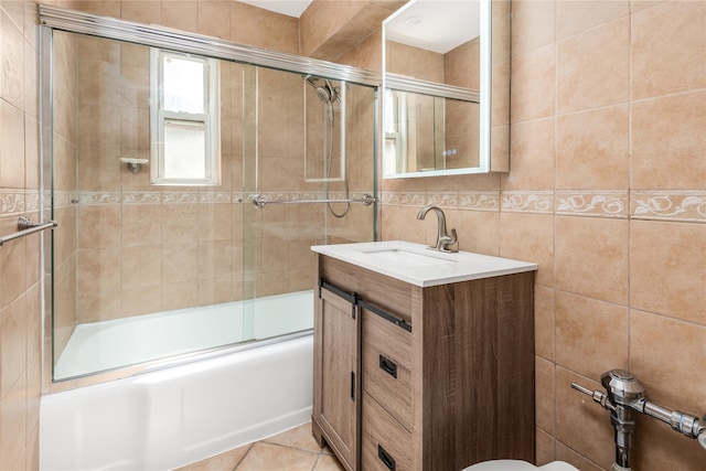 3965 51st St Unit 1C, Woodside, NY 11377 - bathroom with tile walls, shower / bath combination with glass door, and vanity