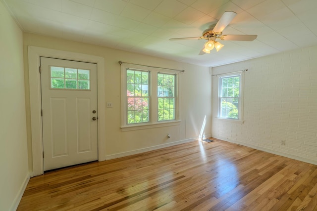 6 Knolls Rd, Poughkeepsie, NY 12601 - entryway with light wood-style floors, ceiling fan, brick wall, and baseboards