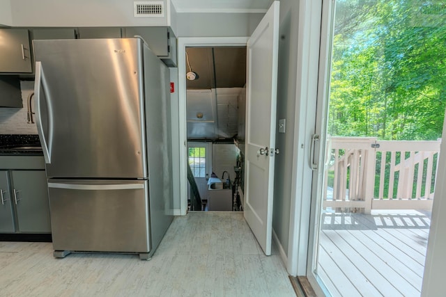 6 Knolls Rd, Poughkeepsie, NY 12601 - kitchen with freestanding refrigerator, gray cabinets, light wood-type flooring, and dark countertops