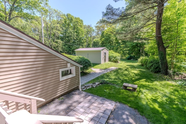6 Knolls Rd, Poughkeepsie, NY 12601 - view of green lawn featuring a patio area and an outbuilding
