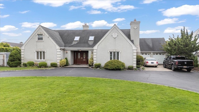 4520 Merrick Rd, Massapequa, NY 11758 - view of front of property with a front lawn, driveway, stucco siding, a chimney, and roof with shingles