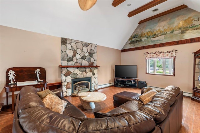 4520 Merrick Rd, Massapequa, NY 11758 - living area featuring a baseboard heating unit, wood finished floors, and a stone fireplace