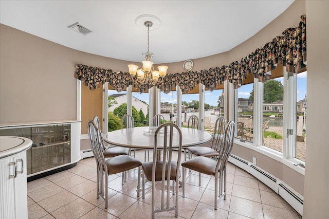 4520 Merrick Rd, Massapequa, NY 11758 - dining area featuring a chandelier, baseboard heating, and dark aggregate flooring