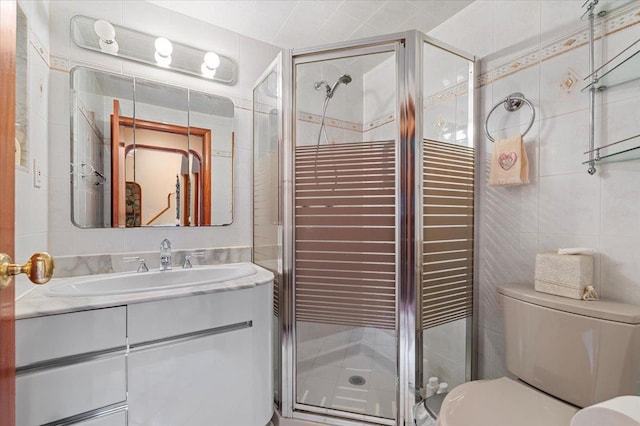 4520 Merrick Rd, Massapequa, NY 11758 - bathroom featuring tile walls, vanity, toilet, and a stall shower