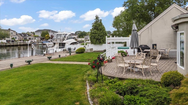 4520 Merrick Rd, Massapequa, NY 11758 - view of yard with a patio area and a water view