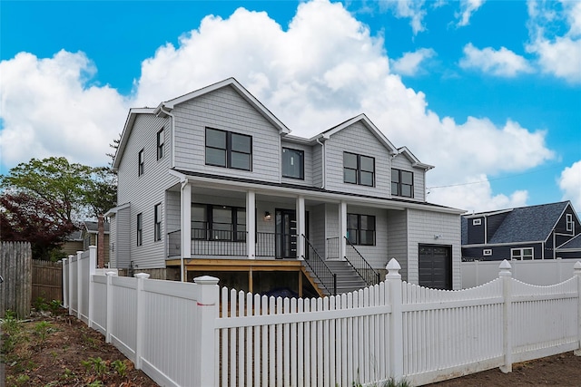 482 S 5th St, Lindenhurst, NY 11757 - view of front of property featuring covered porch, a fenced front yard, and stairway