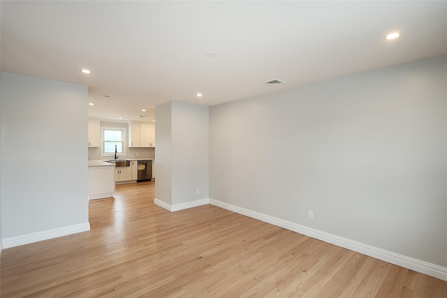 482 S 5th St, Lindenhurst, NY 11757 - unfurnished living room featuring light wood-type flooring, recessed lighting, and baseboards
