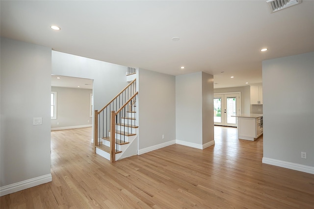 482 S 5th St, Lindenhurst, NY 11757 - empty room featuring stairway, light wood-style flooring, recessed lighting, and baseboards