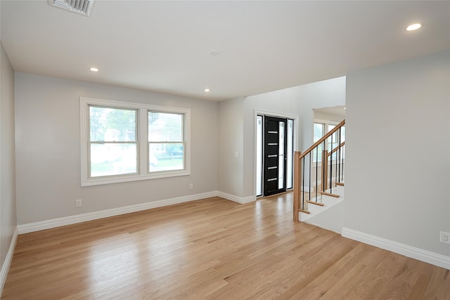 482 S 5th St, Lindenhurst, NY 11757 - empty room featuring light wood-type flooring, baseboards, stairs, and recessed lighting