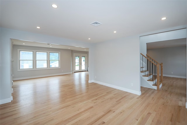 482 S 5th St, Lindenhurst, NY 11757 - spare room with light wood finished floors, recessed lighting, stairway, and baseboards