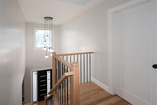 482 S 5th St, Lindenhurst, NY 11757 - stairs with wood finished floors and baseboards