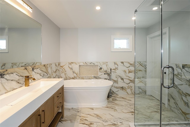 482 S 5th St, Lindenhurst, NY 11757 - full bathroom featuring tile walls, a marble finish shower, marble tiled flooring, a freestanding tub, and recessed lighting