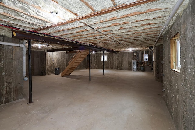 482 S 5th St, Lindenhurst, NY 11757 - unfinished basement featuring water heater and stairway