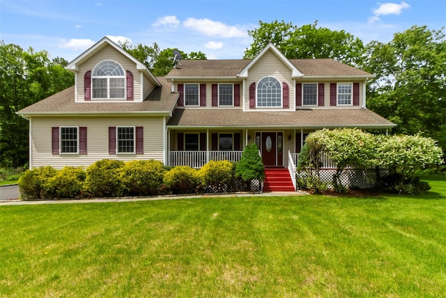 1 Lovely Ln, Carmel, NY 10512 - colonial home featuring a front lawn, a porch, and roof with shingles