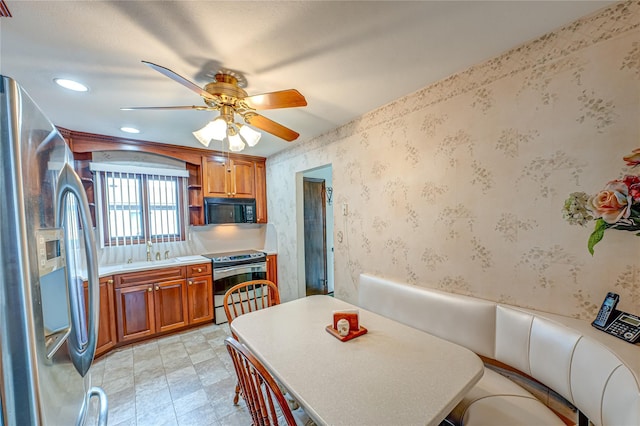 50 W Hampton Rd, Lindenhurst, NY 11747 - dining room with a ceiling fan, recessed lighting, and wallpapered walls