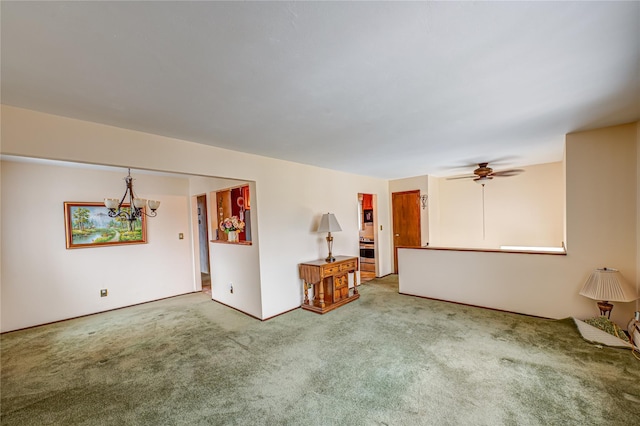 50 W Hampton Rd, Lindenhurst, NY 11747 - carpeted empty room featuring a chandelier and ceiling fan