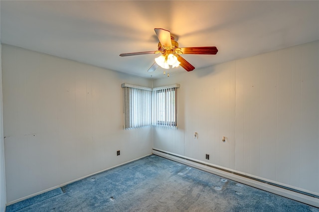 50 W Hampton Rd, Lindenhurst, NY 11747 - empty room with baseboard heating, carpet floors, and a ceiling fan