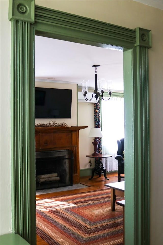 763 Old State Route 22, Dover Plains, NY 12522 - living area with wood finished floors, a chandelier, and a fireplace with flush hearth