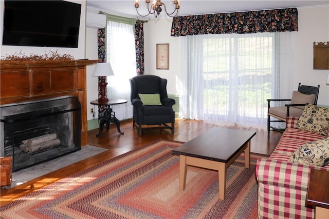 763 Old State Route 22, Dover Plains, NY 12522 - living area with a chandelier, a fireplace with flush hearth, wood finished floors, a wall mounted air conditioner, and ornamental molding